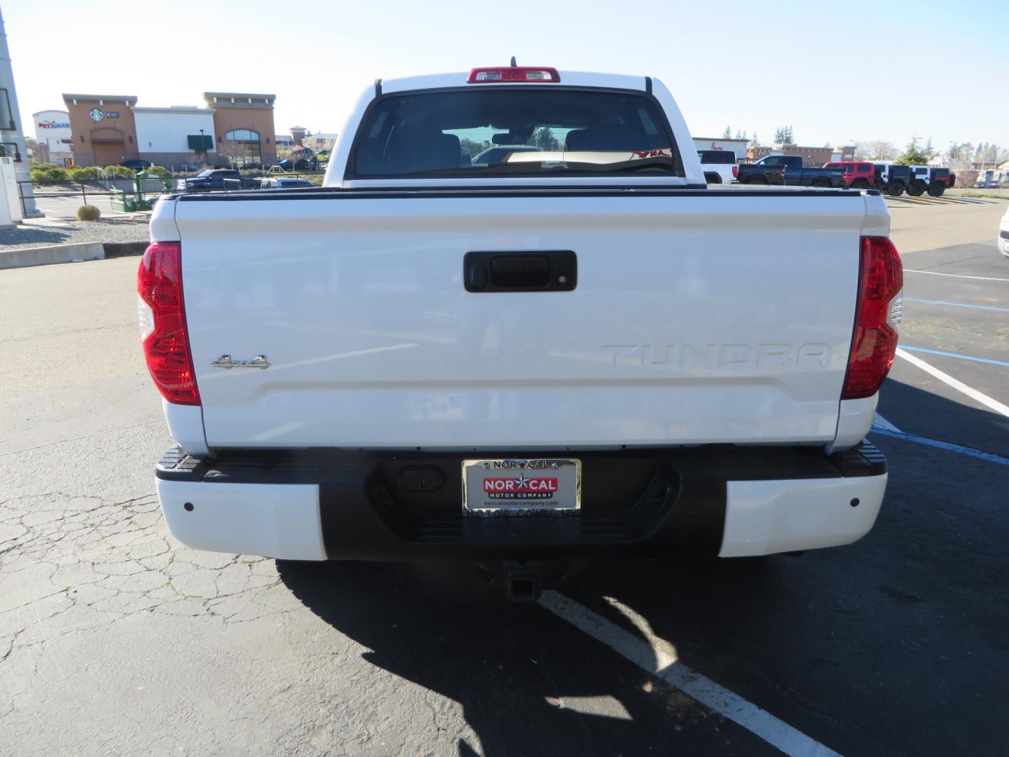 2020 White /GREY Toyota Tundra SR5 (5TFDY5F19LX) with an 5.7L engine, automatic transmission, located at 2630 Grass Valley Highway, Auburn, CA, 95603, (530) 508-5100, 38.937893, -121.095482 - Features - King Off Road adjustable remote reservoir coil overs, King 2.5 adjustable remote reservoir rear shocks, Method Race wheels, Falken Wildpeak tires, Sliders, Bed braces, Borla Exhaust, Husky floor mats, Window tint, and Ram phone mounts. - Photo#5